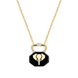 Necklace with black ceramic charm shaped like a lock with a gold elephant inlay