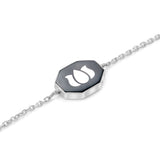 Inessa black ceramic lotus charm with white rhodium silver showing contrast design from Strength Collection