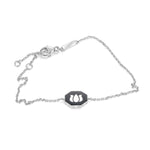 Inessa double-sided black ceramic lotus bracelet in white rhodium finished sterling silver with adjustable sizing