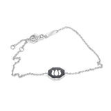 Inessa double-sided black ceramic lotus bracelet in white rhodium finished sterling silver with adjustable sizing