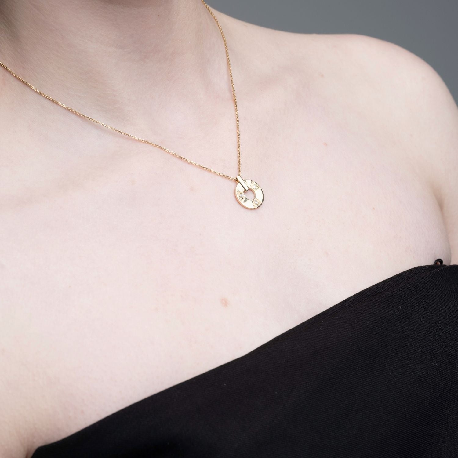 Inessa lotus diamond pendant necklace worn by model, 14k reclaimed gold from Strength Collection