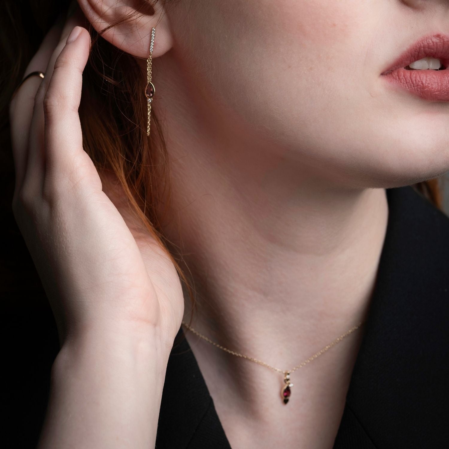 Inessa lotus pink tourmaline necklace styled for professional wear, 14k gold with blazer