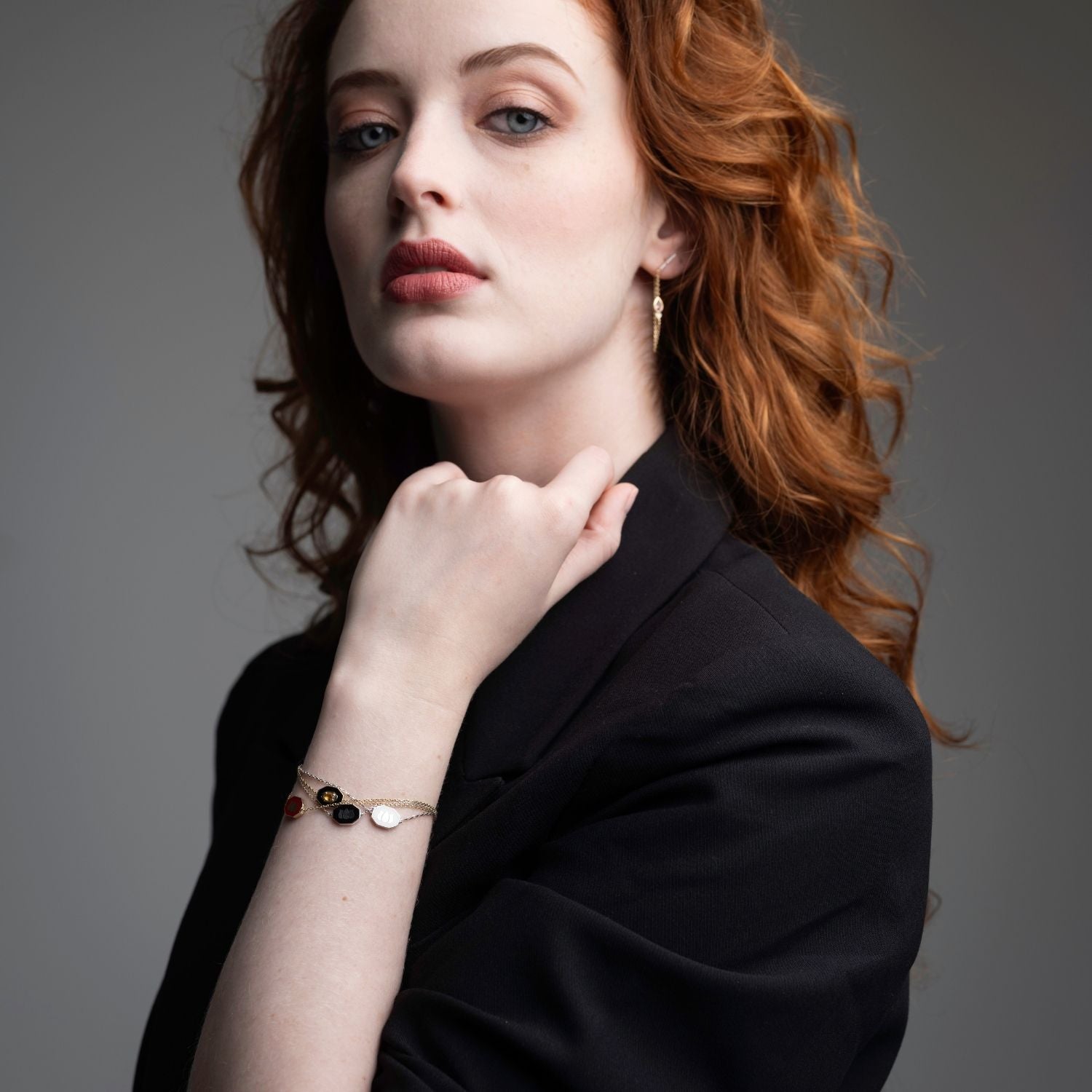 Inessa lotus white ceramic bracelet worn in professional setting, sterling silver from Strength Collection