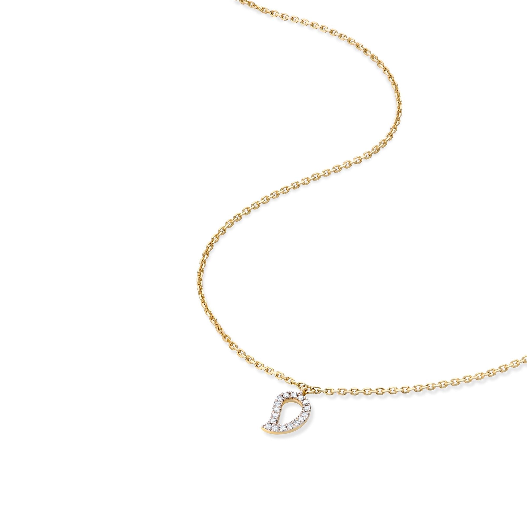 Delicate gold mango pendant with sparkling diamond outline shown on curved chain for scale reference