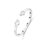 Angled view of mango silver bracelet showing curved bangle form and sculptural mango end details