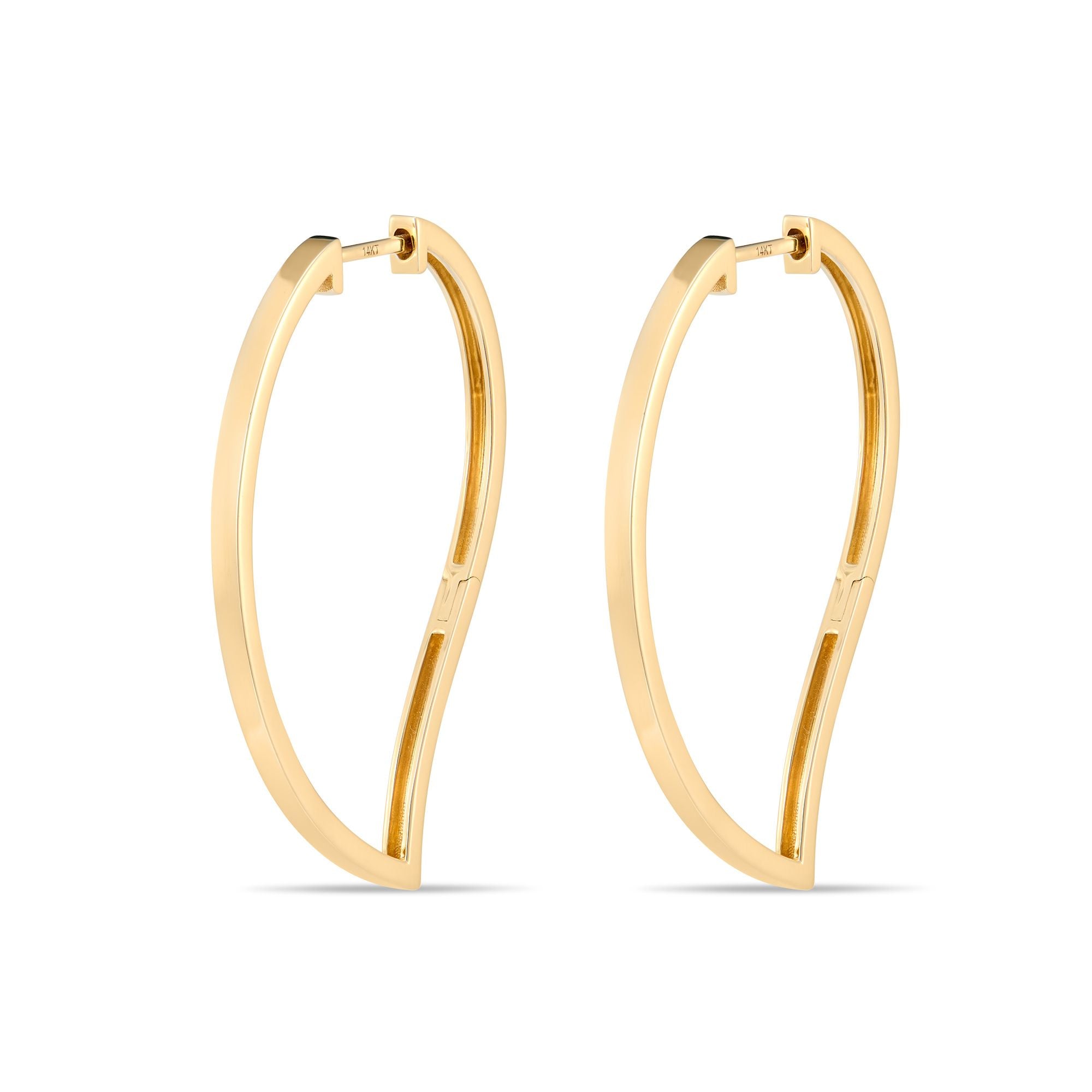 Angled view of mango-shaped gold hoop earrings displaying sculptural curves and statement-making presence