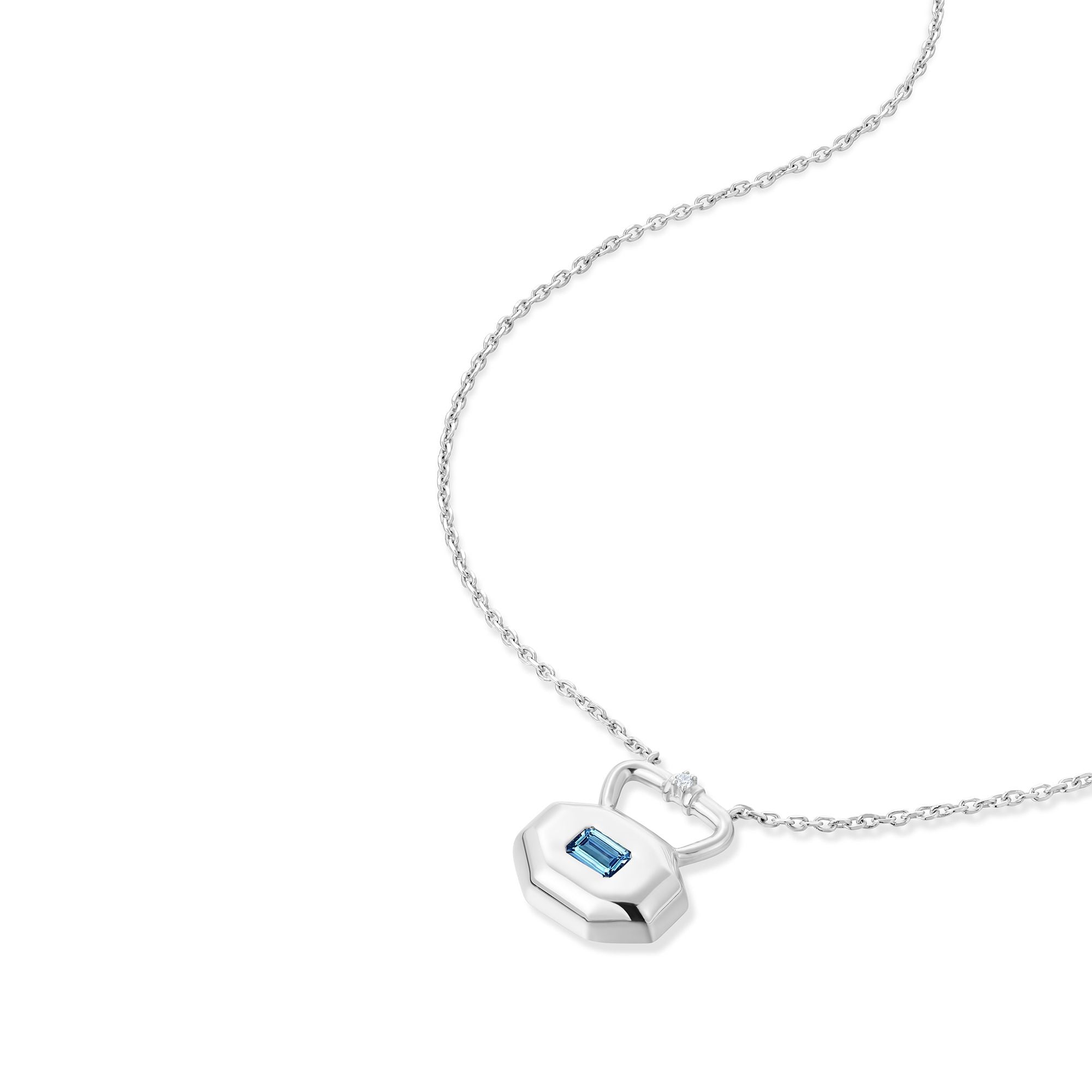 March aquamarine birthstone lock pendant shown at angle displaying natural movement and light reflection on silver chain