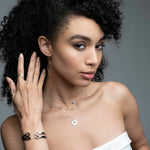 Woman wearing mixed metal trio layering necklace with gold beads and silver chain from Stackable Collection