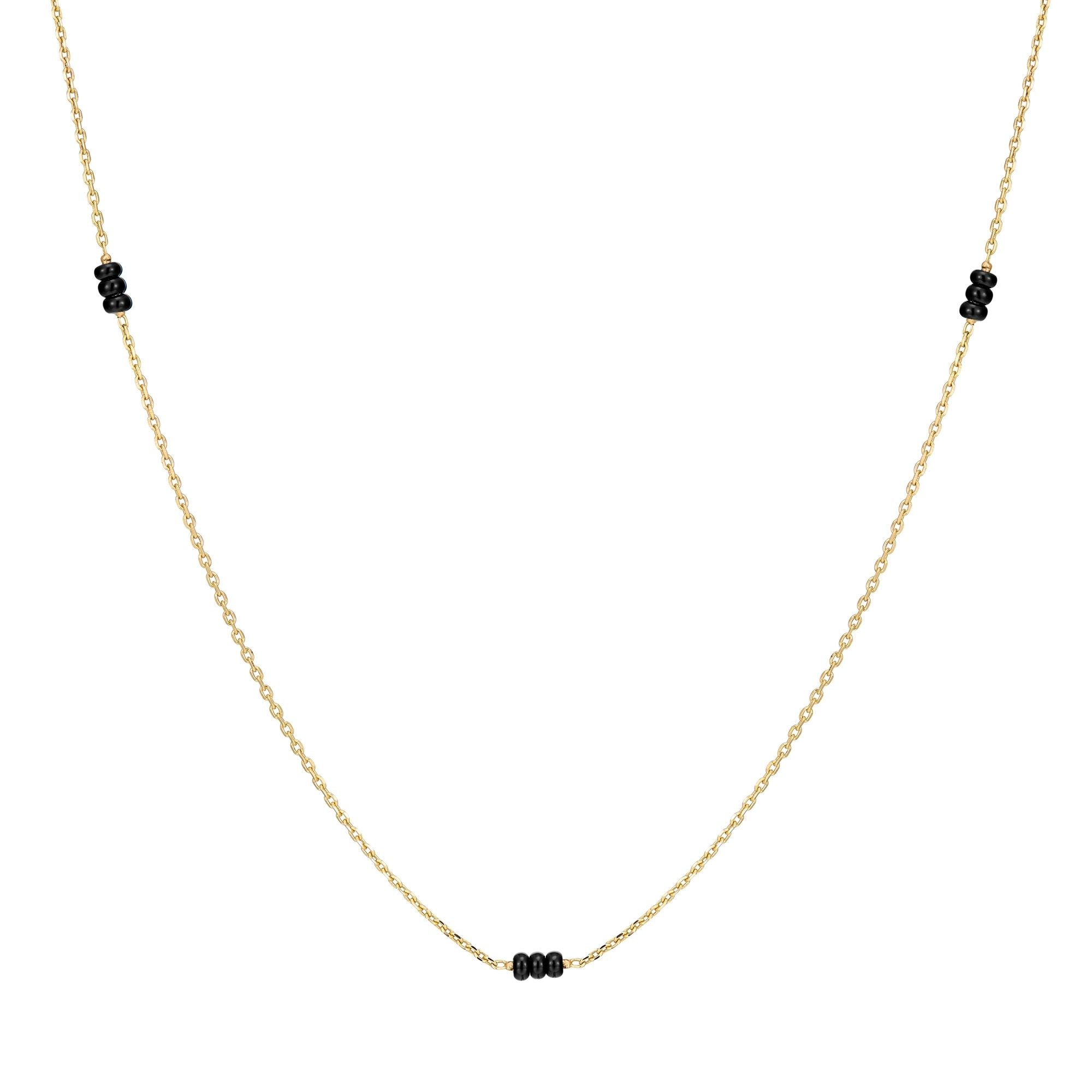 Inessa adjustable black onyx necklace showing three bead stations, 14k gold stackable design