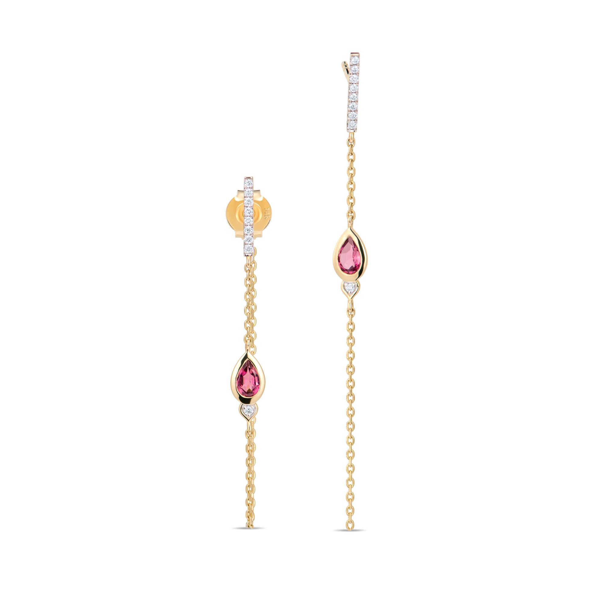 Close-up of lotus bud earring showing diamond bar and pink tourmaline drop with chain detail