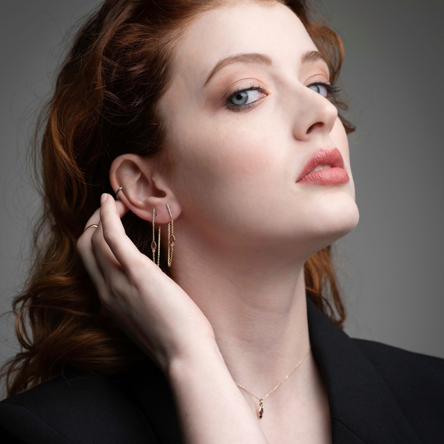 Inessa pink tourmaline drop earrings lifestyle styling, 50mm lotus bud design in 14k gold