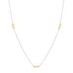 Inessa rhodium plated silver necklace with three 14k gold bead stations, front layout view