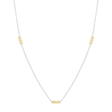 Inessa rhodium plated silver necklace with three 14k gold bead stations, front layout view
