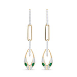 14k gold serpent chain drop earrings with emerald eyes and diamonds from Inessa Renewal Collection