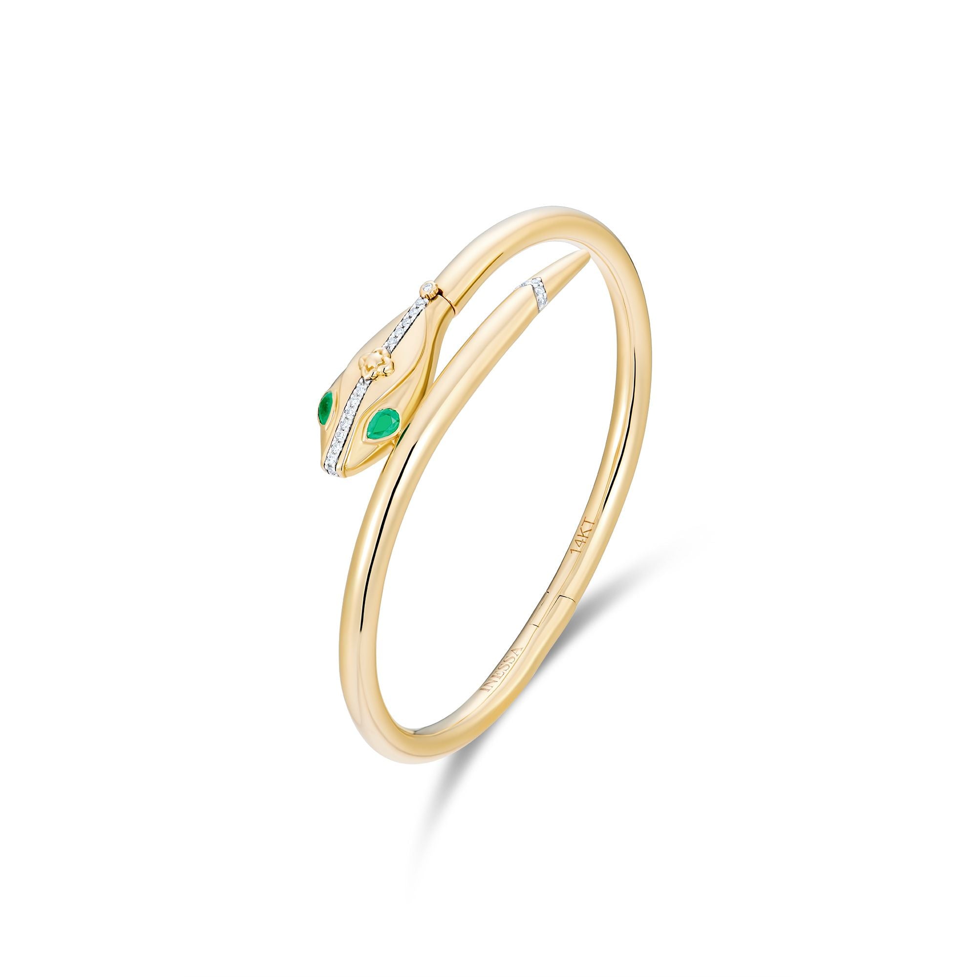 Side view of 14k gold serpent hinged bangle showing emerald eyes and diamond spine details, transformation jewelry