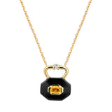 Gold necklace with a black ceramic pendant shaped like a lock featuring an oval citrine on a white background