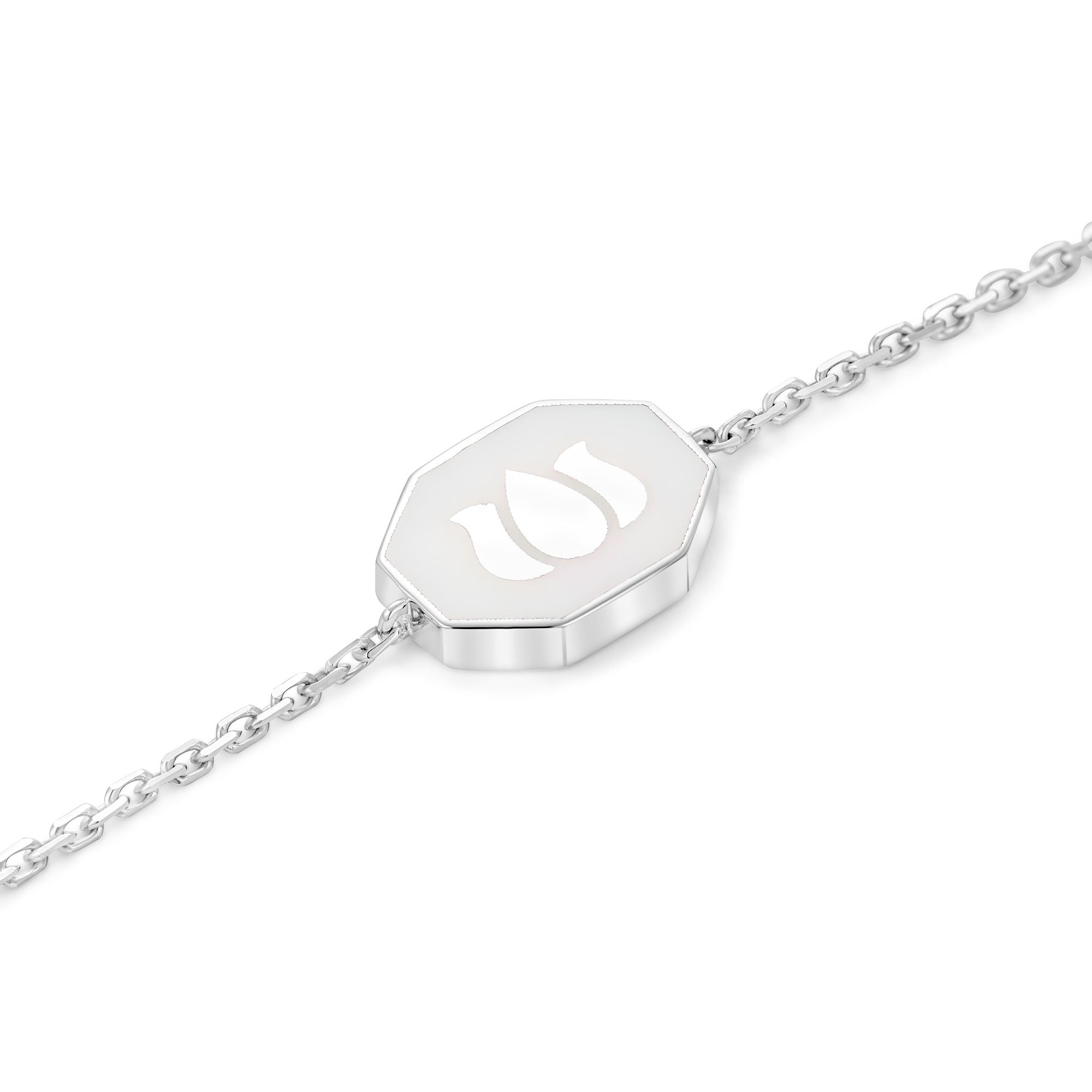 Inessa white ceramic lotus charm on recycled sterling silver bracelet showing octagonal design from Strength Collection